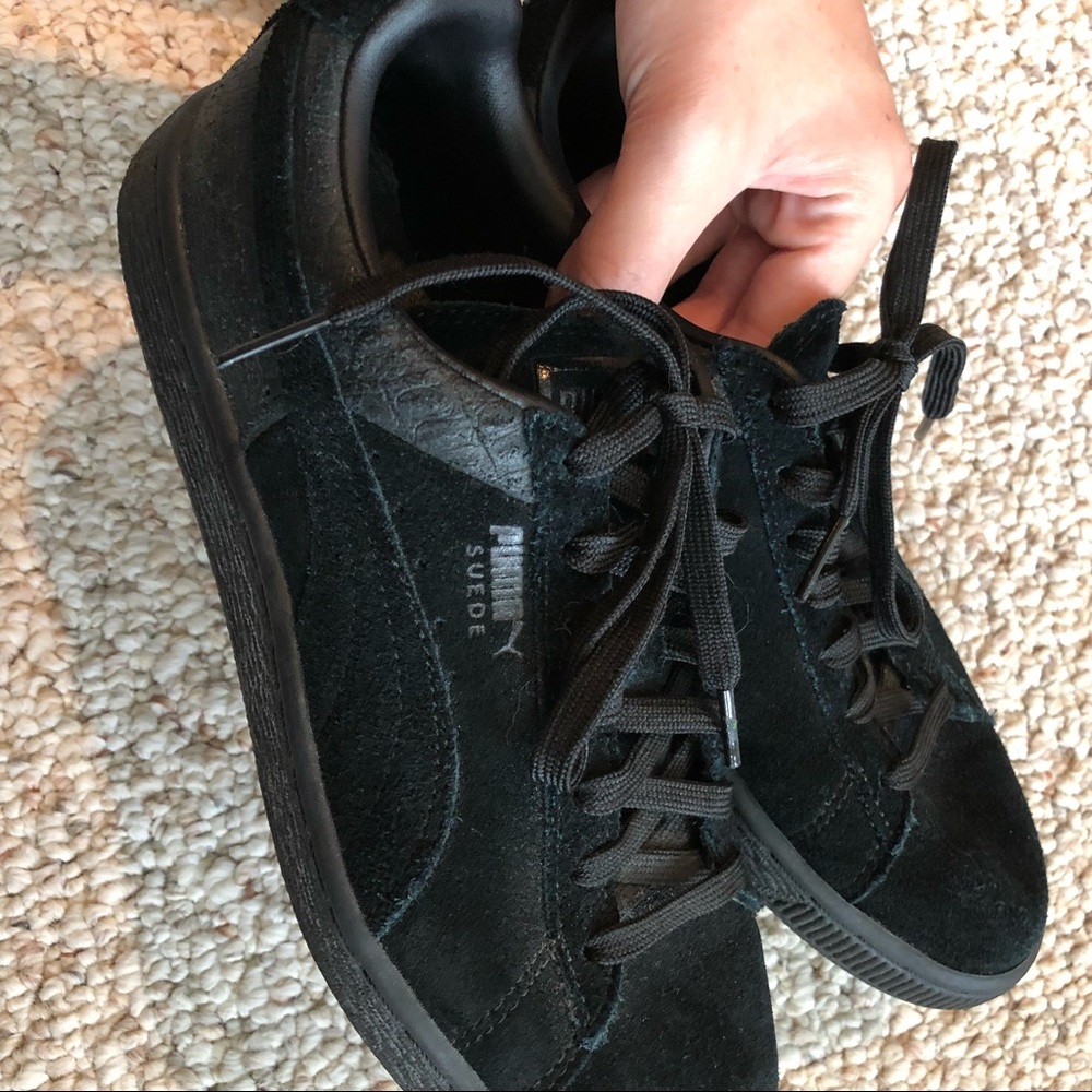 All black suede pumas
